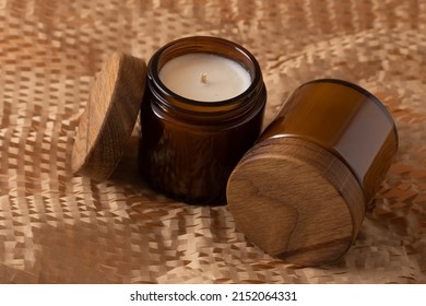 Soy Candles In A Brown Glass Jar With A Wooden Lid. Aromatherapy. Candle On A Beige Background Closeup. Place For A Label. Wax And Wick. Home Decor. Handmade. Air Freshener. Soy Candle Concept