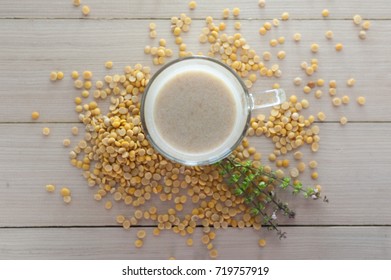 Soy Milk With Soy Bean On Wood Plate Top View