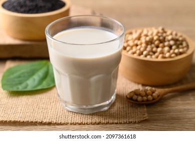 Soy milk with black sesame on wooden background, Healthy drink