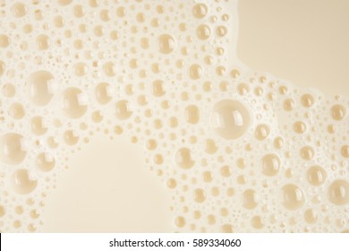 Soy Milk Bubble Foam Background On Top View Close Up