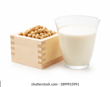 Soy milk in a glass and soybeans in a masu box on a white background