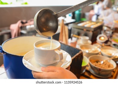 Soy Milk Pouring In To A Cup