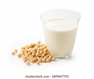 Soy milk and soybeans in a glass on a white background