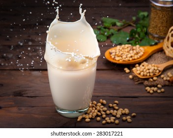 Soy Milk Splash With Beans On Wood