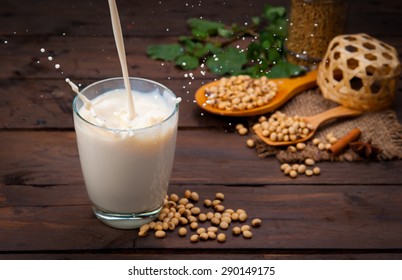 Soy Milk Splash With Beans On Wood