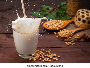 Soy Milk Splash With Beans On Wood