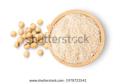 Soy protein powder or soya flour in wooden bowl and soybeans isolated on white background, Top view. Flat lay.