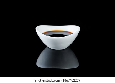 
Soy Sauce In A Bowl On A Black Background