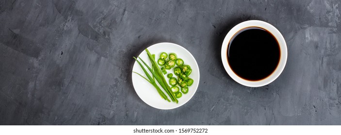 Soy Sauce, Onion And Green Pepper On Gray Concrete Background. Flat Lay, Top View, Mock Up, Overhead, Template