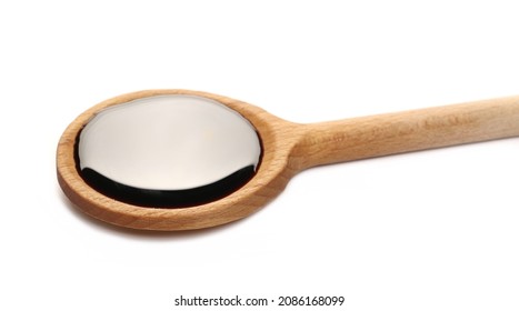 Soy Sauce With Wooden Spoon Isolated On White Background