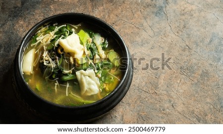 Soybean paste stew made with various vegetables and flour dough