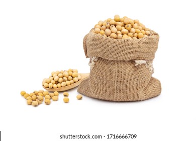 soybean in sack and wooden bowl with  isolated on white background.