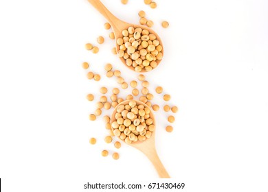 Soybeans in a wooden spoon isolated on a white background, Top view with copy space and text.