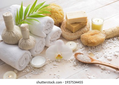Spa bath setting on wooden with pile of white salt 

