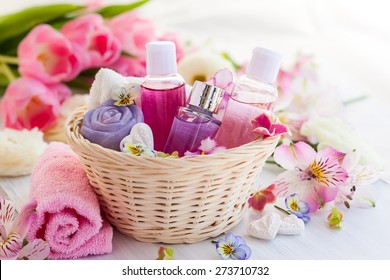 Spa Bath Toiletries Set In Basket With Fresh Flowers
