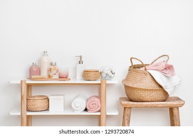 Spa Bathroom Interior With Wooden Shelf, Stool And Skincare Products