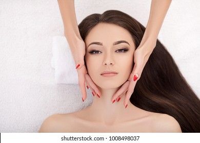 Spa. Beautiful Young Woman Getting a Face Treatment at Beauty Salon. - Powered by Shutterstock