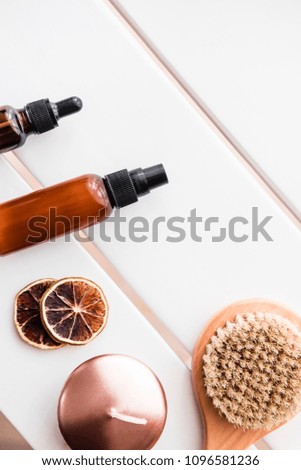 Spa beauty cosmetics on white table from above. Copy space, vertical