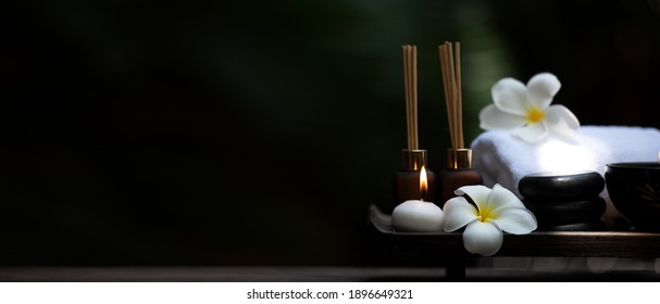 Spa beauty massage healthy wellness background. Spa Thai therapy treatment aromatherapy for body woman with flower Plumeria nature candle for relax summer time. copy space for banner