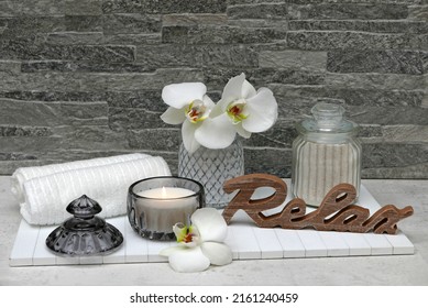Spa Compasition: With massage oil, orchid flowers, towels and aromatic candle.
