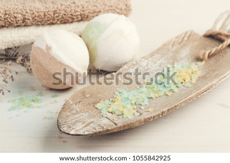 SPA composition with bath bombs, salts. Wooden background 
