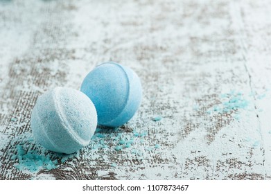 SPA composition with blue bath bombs. Wooden background 