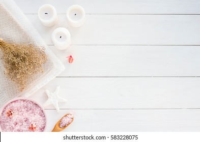 Spa Composition With Candles, Sea Salt And Flowers On White Wooden Background. Flat Lay.