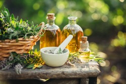 Spa composition with Fresh herbs and different types of oils. Selective focus., a Health & Medical Photo by Valentina_G