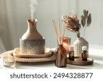 Spa composition with incense sticks, air humidifier and aroma oils.