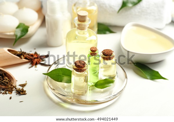 Spa\
composition with tea tree oil on white\
background