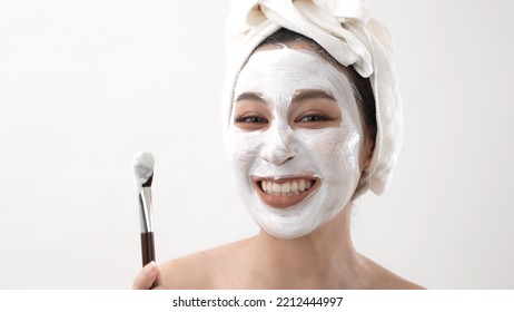 Spa Concept Of 4k Resolution. Asian Woman Introducing Facial Spa Treatment On White Background. Mud Mask. Green Tea Extract.