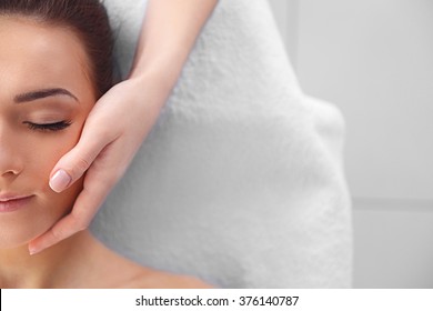 Spa Concept. Face Massage. Young Woman Getting Spa Treatment, Close Up