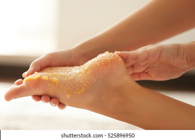 Spa Concept. Hands Massaging Female Foot With Scrub