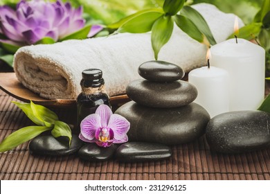 Spa Concept With Zen Basalt Stones And Massage Oil