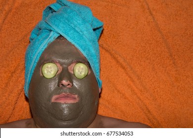 Spa and facials. Funny fat man and clay mask.
