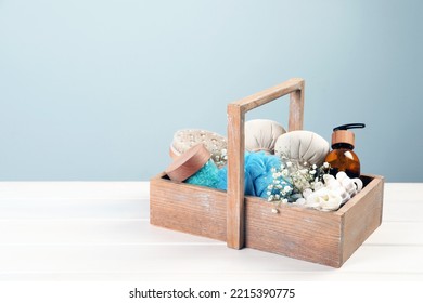 Spa Gift Set With Different Products In Crate On White Wooden Table