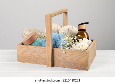 Spa Gift Set With Different Products In Crate On White Wooden Table