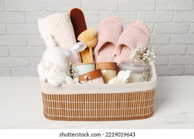 Spa Gift Set In Wicker Basket On White Marble Table