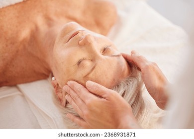 Spa, head massage and senior woman at a spa for luxury, self care and facial healing treatment. Relax, wellness and elderly female person on a retirement retreat for face therapy at natural salon. - Powered by Shutterstock