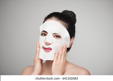 Spa, Healthcare. Asian Girl With A Cosmetic Mask.