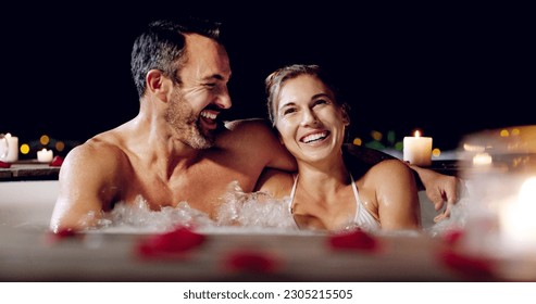 Spa, love and couple in a jacuzzi happy, smile and relax one date night at a wellness resort. Zen, hot tub and man with woman laughing, peace and enjoying a romantic vacation, holiday or anniversary - Powered by Shutterstock