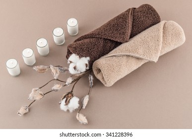 Spa Luxury Towels, Cotton Branch, And Lit Candles