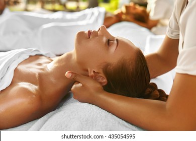 Spa Massage. Closeup Of Beautiful Healthy Happy Smiling Woman Getting Relaxing In Day Spa Salon Outdoors. Masseur Hand Massaging Neck With Aromatherapy Oil. Relax Body Care Beauty Treatment Concept - Powered by Shutterstock