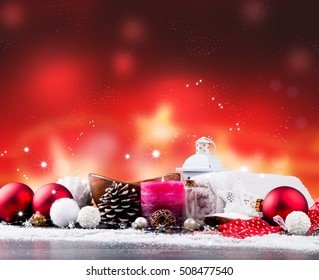 spa massage setting, product, oil and christmas decoration on wooden background, Christmas wellness concept