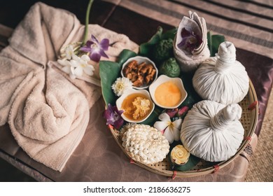 Spa Massage Wellness Decorations Setting On Wood Table. Thai Spa Massage Traditional Compress For Hot Massage And Spa Relaxing Treatment Of Office Syndrome. Massage For Health Concept.