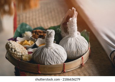 Spa Massage Wellness Decorations Setting On Wood Table. Thai Spa Massage Traditional Compress For Hot Massage And Spa Relaxing Treatment Of Office Syndrome. Massage For Health Concept.