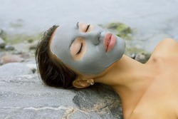 Spa Outdoor, Beautiful Young Woman Lying With Natural Dead Sea Facial Mask On Her Face.