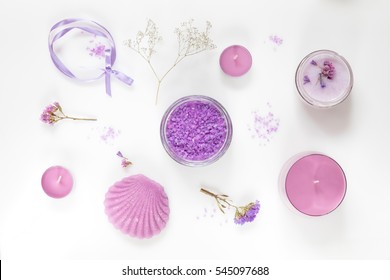 Spa products. Lavender bath salts, dry flowers, soap, cosmetic cream and candles. Violet purple concept. Flat lay on white background, top view. - Powered by Shutterstock