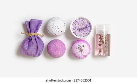 Spa Products With Natural Lavender Essential Oils, Bath Salt, Scented Bag, Bath Bombs, Aroma Water On White Background. Aromatherapy And Herbal Medicine, Cosmetics For Body Treatment And Good Sleep