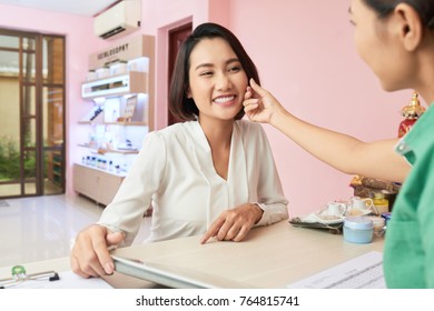 Spa Salon Owner Touching Soft Skin Of Patient After Procedure